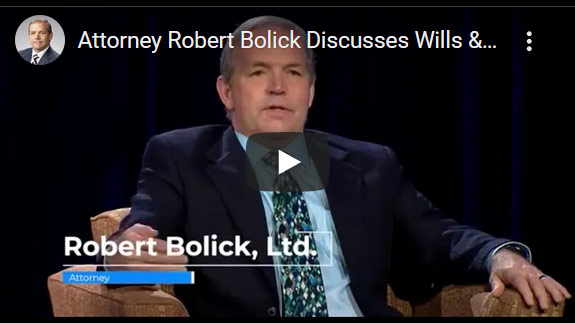 Las Vegas trust lawyer Robert Bolick, in a suit and tie, discusses wills in a YouTube video titled “Attorney Robert Bolick Discusses Wills.”.