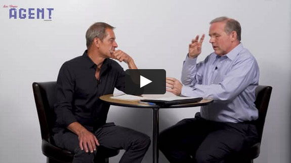 Two men sit at a round table talking; one in black, one in blue. Leverage AGENT appears at the top left of the image.